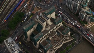 AX115_142E - 5.5K aerial stock footage of tilting to the MI6 Building in London, England