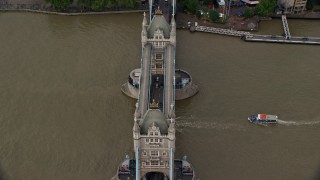 5.5K aerial stock footage of boats on River Thames passing under Tower Bridge, London, England Aerial Stock Footage | AX115_173E