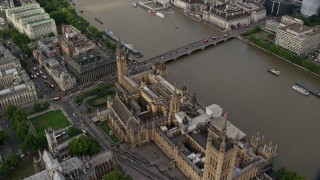 5.5K aerial stock footage orbit above Big Ben and Parliament beside the River Thames, London, England Aerial Stock Footage | AX115_201