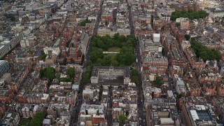 5.5K aerial stock footage approach United States Embassy among office buildings, London, England Aerial Stock Footage | AX115_228E