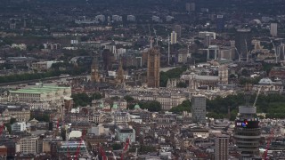 5.5K aerial stock footage of Big Ben and Parliament among city buildings, London, England Aerial Stock Footage | AX115_239E