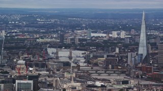 5.5K aerial stock footage of Tower Bridge over the Thames, The Shard and cityscape, London, England Aerial Stock Footage | AX115_243