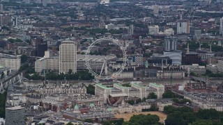 5.5K aerial stock footage of the London Eye and nearby city buildings, England Aerial Stock Footage | AX115_249