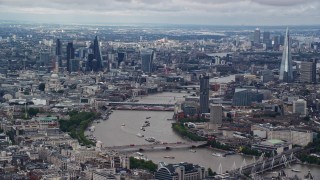 5.5K aerial stock footage of a wide view of the cityscape, from Central London to Shard by River Thames, England Aerial Stock Footage | AX115_250E