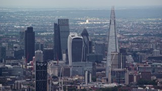 AX115_277E - 5.5K aerial stock footage of a view of Central London skyscrapers, The Shard and Strata, England