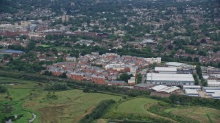 5.5K aerial stock footage of apartment buildings and warehouses, Redhill, England Aerial Stock Footage | AX115_312E