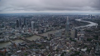 AX116_008E - Aerial stock footage of Skyscrapers, River Thames and Central London cityscape, England, twilight