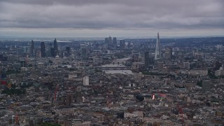 5.5K aerial stock footage of a view of the River Thames and Central London skyscrapers, England, twilight Aerial Stock Footage | AX116_049