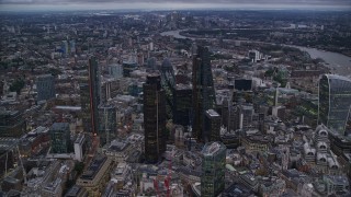 5.5K aerial stock footage of flying by skyscrapers in Central London, England, twilight Aerial Stock Footage | AX116_085E