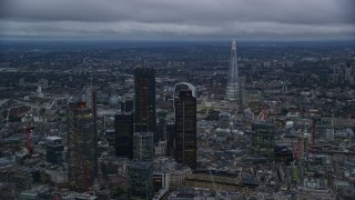 5.5K aerial stock footage flyby skyscrapers and cityscape, The Shard in background, London, England, twilight Aerial Stock Footage | AX116_091E