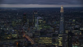 5.5K aerial stock footage of flying by The Shard and Central London skyscrapers, London, England, night Aerial Stock Footage | AX116_152E