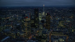 5.5K aerial stock footage of Central London skyscrapers with The Shard in background, England, night Aerial Stock Footage | AX116_169E