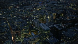 5.5K aerial stock footage of flying by Central London office buildings, London, England, night Aerial Stock Footage | AX116_171