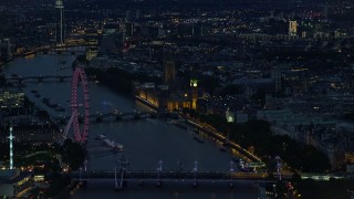 5.5K aerial stock footage flyby London Eye, Big Ben and Parliament, River Thames bridges, London, England, night Aerial Stock Footage | AX116_177E