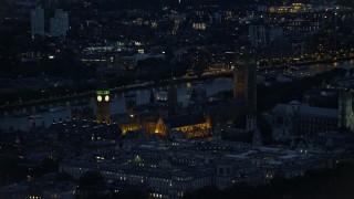 5.5K aerial stock footage of flying by Big Ben and British Parliament, London, England, night Aerial Stock Footage | AX116_181