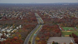 5.5K aerial stock footage of Southern State Parkway in Autumn, Farmingdale, New York Aerial Stock Footage | AX117_004E