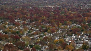 5.5K aerial stock footage of circling a suburban neighborhood in Autumn, Merrick, New York Aerial Stock Footage | AX117_022E