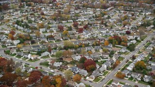 5.5K aerial stock footage of flying over suburban neighborhoods in Autumn, Wantagh, New York Aerial Stock Footage | AX117_048E