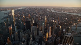 5.5K aerial stock footage of Lower and Midtown Manhattan skyscrapers at sunrise, New York City Aerial Stock Footage | AX118_087E