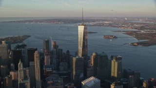 5.5K aerial stock footage of gleaming Freedom Tower at sunrise in Lower Manhattan, New York City Aerial Stock Footage | AX118_094E