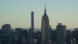 5.5K aerial stock footage of the iconic Empire State Building at sunrise in Midtown, New York City Aerial Stock Footage | AX118_166