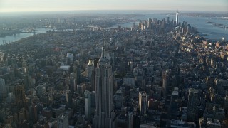 5.5K aerial stock footage of a wide view of Manhattan, from Empire State Building to Downtown at sunrise in New York City Aerial Stock Footage | AX118_203