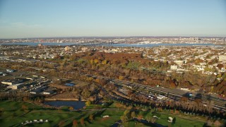 5.5K aerial stock footage of freeway and cemetery at sunrise in Jersey City, New Jersey Aerial Stock Footage | AX118_220E