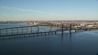 5.5K aerial stock footage of Newark Bay Bridge and Lehigh Valley Bridge at sunrise in Newark, New Jersey Aerial Stock Footage | AX118_223E