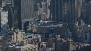 AX119_025 - 5.5K aerial stock footage of orbiting Madison Square Garden Arena in Midtown, New York City