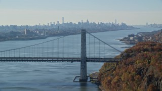 5.5K aerial stock footage of the Midtown skyline, flyby George Washington Bridge in Autumn, New York City Aerial Stock Footage | AX119_050