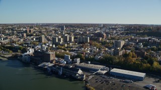 AX119_063E - 5.5K aerial stock footage of the riverfront downtown area of Yonkers, New York in Autumn