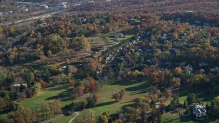 5.5K aerial stock footage of mansions and small town homes in Autumn, Tarrytown, New York Aerial Stock Footage | AX119_085