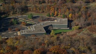 5.5K aerial stock footage of an isolated office building in Autumn, Sleepy Hollow, New York Aerial Stock Footage | AX119_100E