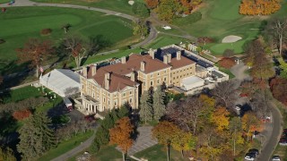 AX119_110 - 5.5K aerial stock footage orbit historical mansion and country club in Autumn, Briarcliff Manor, New York