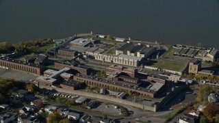 5.5K aerial stock footage of orbiting Sing Sing Prison in Autumn, Ossining, New York Aerial Stock Footage | AX119_114E