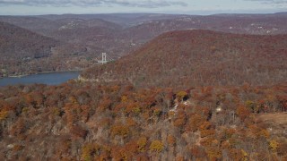 5.5K aerial stock footage of forest in Autumn by the Hudson River, Westchester County, New York Aerial Stock Footage | AX119_149