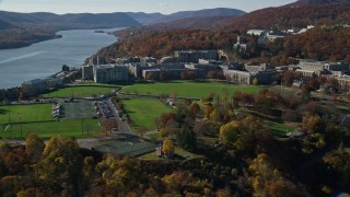 AX119_169E - 5.5K aerial stock footage of circling West Point Military Academy in Autumn, West Point, New York