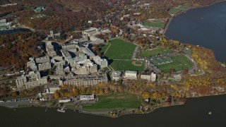 5.5K aerial stock footage of a wide orbit by the campus of West Point Military Academy in Autumn, West Point, New York Aerial Stock Footage | AX119_182E