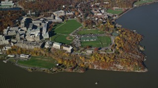 5.5K aerial stock footage of flying away from West Point Military Academy in Autumn, West Point, New York Aerial Stock Footage | AX119_184