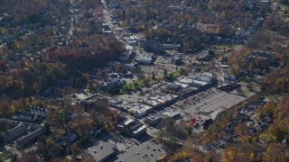 5.5K aerial stock footage of a small town shopping center in Autumn, Mt Kisco, New York Aerial Stock Footage | AX119_210E