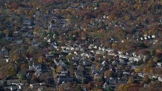 5.5K aerial stock footage orbit a small town neighborhood in Autumn, Greenwich, Connecticut Aerial Stock Footage | AX119_231