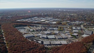 5.5K aerial stock footage of office buildings in Autumn, Plainview, New York Aerial Stock Footage | AX119_249E