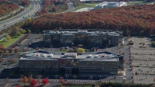 5.5K aerial stock footage of orbiting two office buildings in Autumn, Melville, New York Aerial Stock Footage | AX119_251