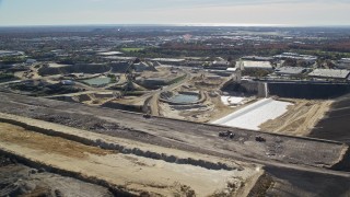 AX119_252 - 5.5K aerial stock footage of a construction site in Autumn, Melville, New York