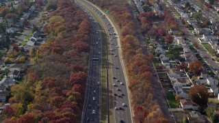 AX120_005E - 5.5K aerial stock footage fly over light traffic on a freeway in Autumn, Massapequa, New York