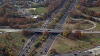 5.5K aerial stock footage follow freeway with light traffic in Autumn, Wantagh, New York Aerial Stock Footage | AX120_013E