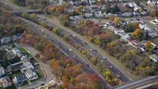 5.5K aerial stock footage of light traffic on a freeway in Autumn, Wantagh, New York Aerial Stock Footage | AX120_016E