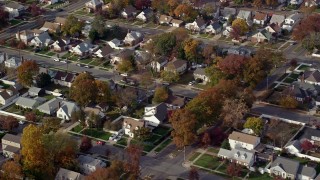 AX120_027E - 5.5K aerial stock footage of blocks of suburban homes in Autumn, Hempstead, New York