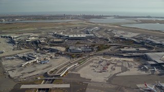 AX120_052E - 5.5K aerial stock footage orbit John F. Kennedy International Airport, New York in Autumn