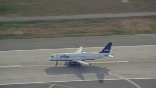 5.5K aerial stock footage track a commercial jet taking off from JFK Airport, New York Aerial Stock Footage | AX120_066E